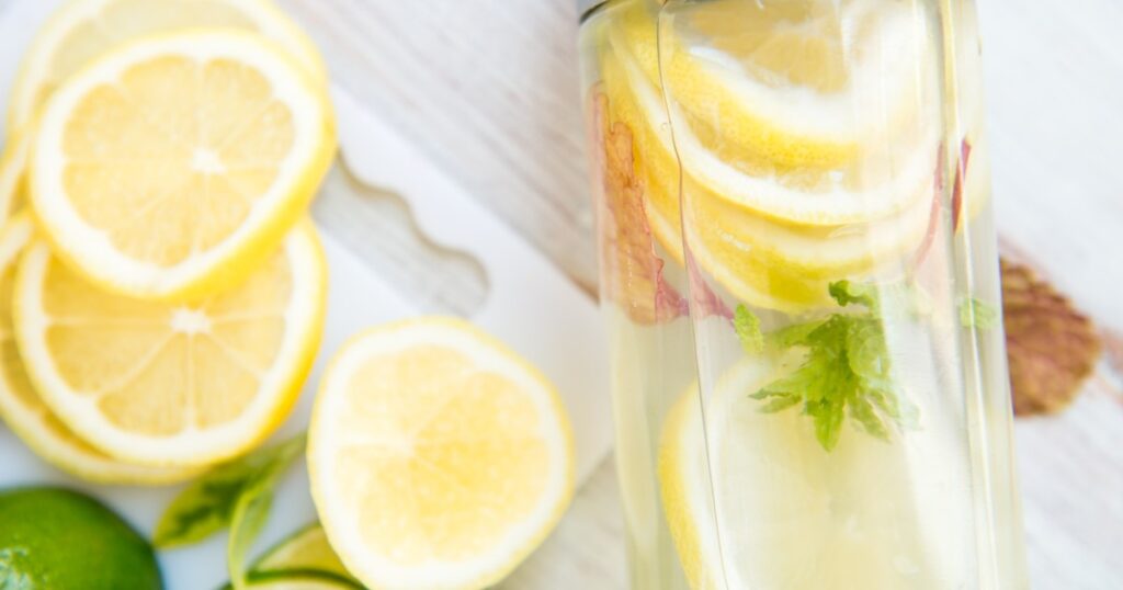lemons-on-cutting-board-and-in-water-bottle-ready-to-drink