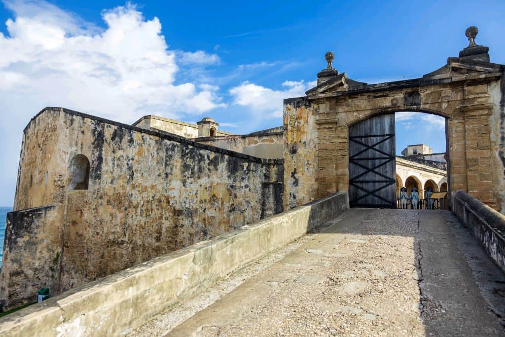 A view of the stone entry into Castillo San Cristóbal with the gates open